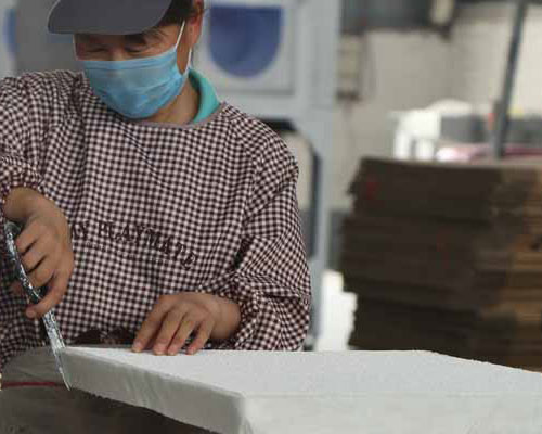 Workers are making ceramic foam filters